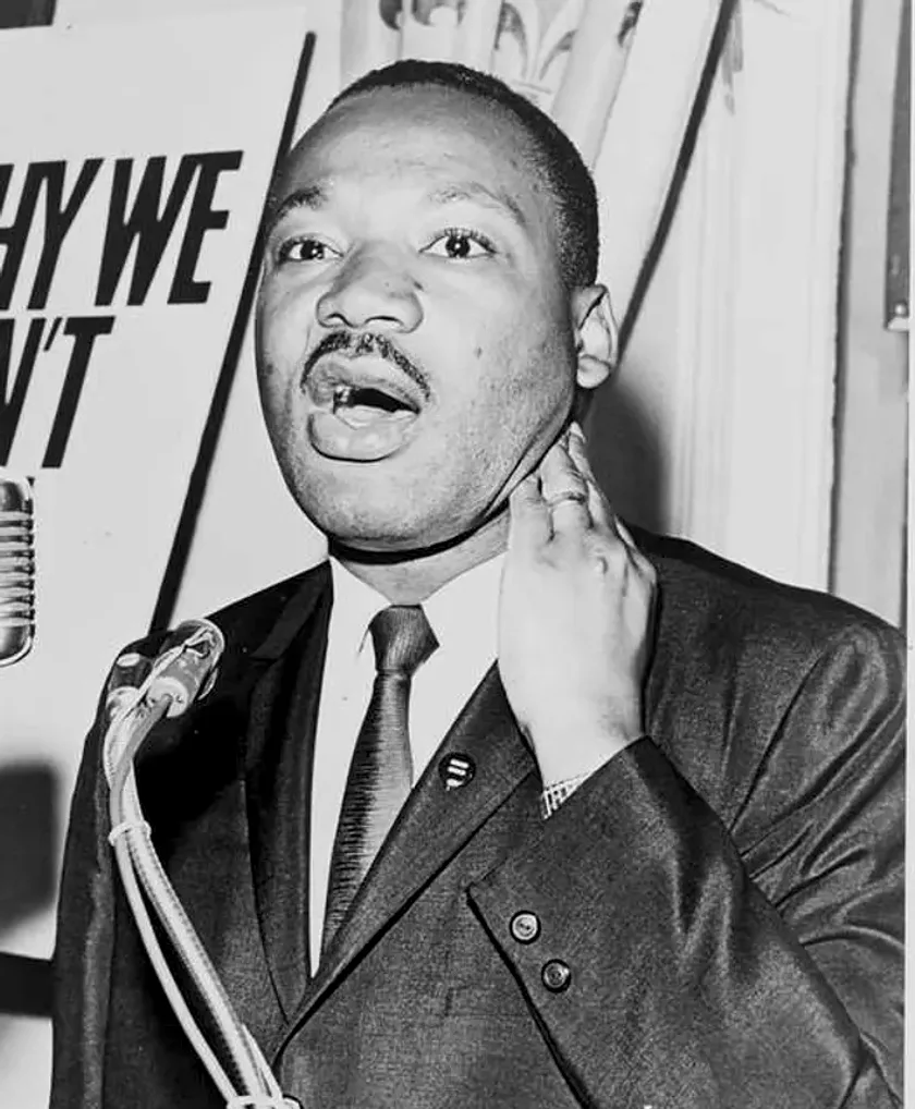 Martin Luther King Jr. speaking at a microphone, 1964